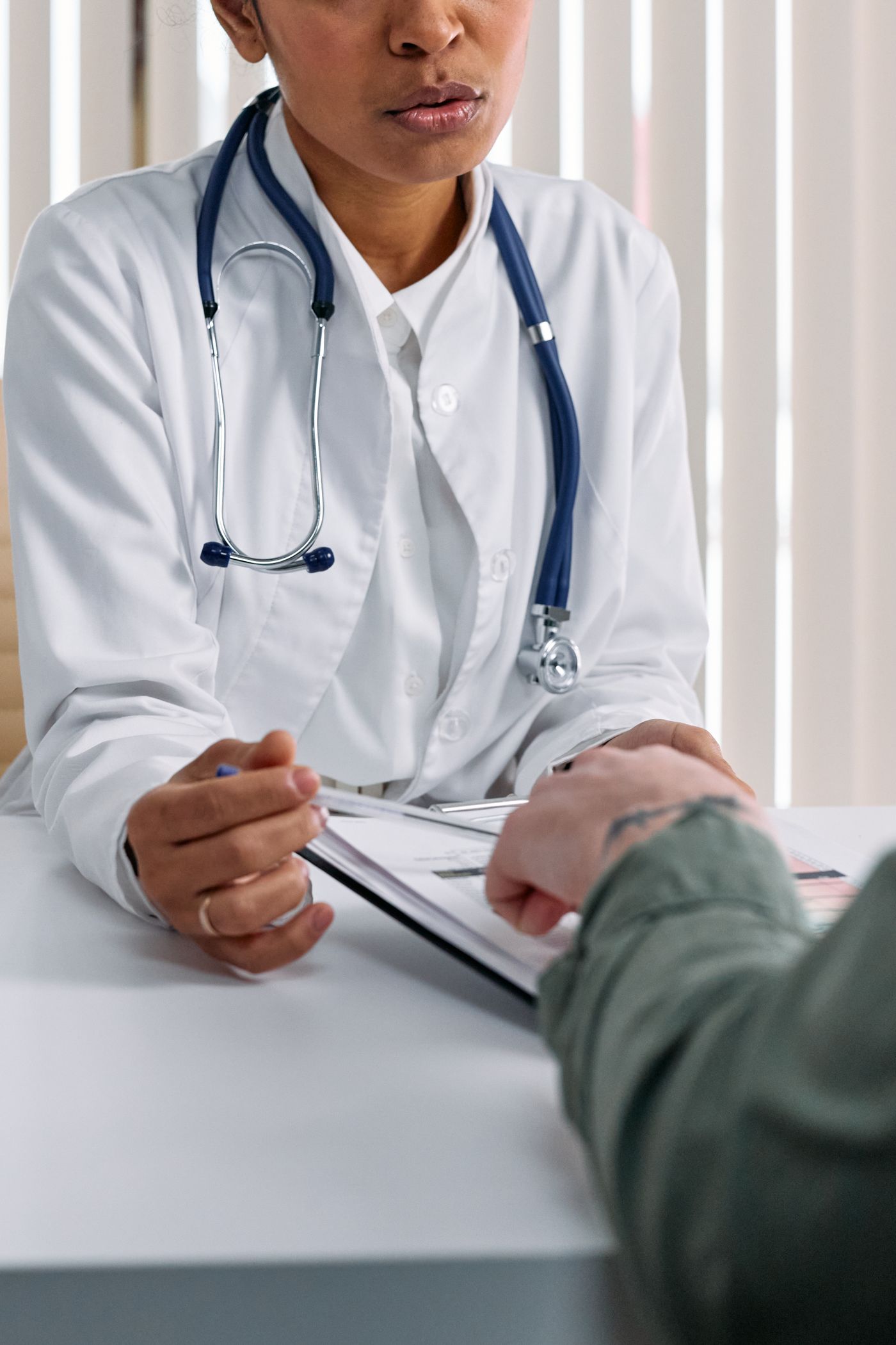 A clinician listening during a patient consultation